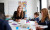 Female primary school teacher sitting at a table web2